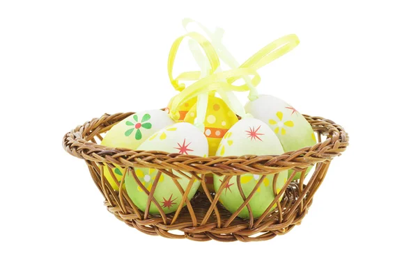 Decorative Easter eggs in basket — Stock Photo, Image