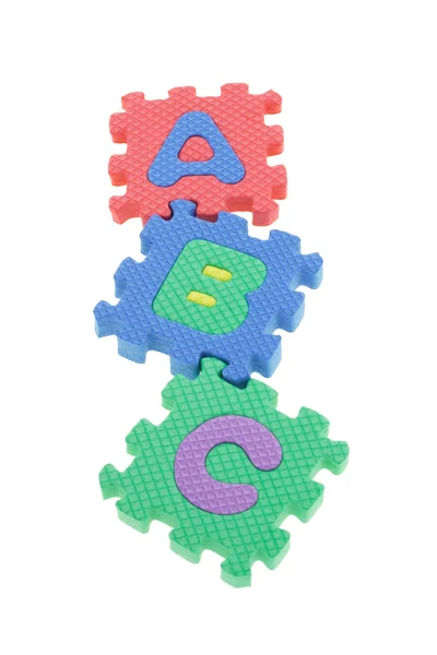Blocos de quebra-cabeça coloridos A B C — Fotografia de Stock