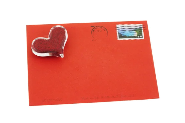 Heart shape symbol on red envelope — Stock Photo, Image