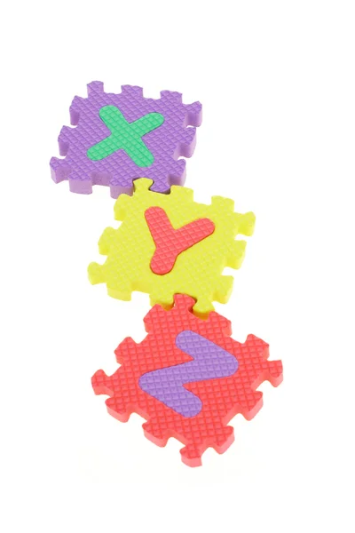 Blocos coloridos de quebra-cabeça XYZ — Fotografia de Stock