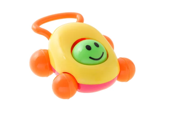 Carro chocalho bebê sorridente colorido — Fotografia de Stock