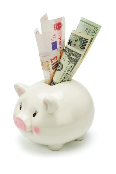 Piggy bank and major world currency notes — Stock Photo, Image