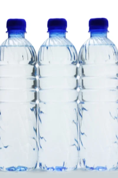 Drie flessen mineraal water — Stockfoto