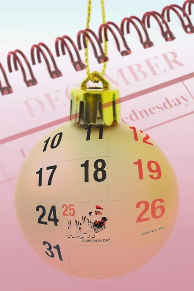 Christmas bauble and calendar — Stock Photo, Image