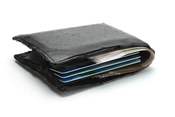 Готівкові та кредитні картки в старому гаманці — стокове фото