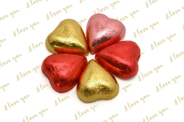Srdce ve tvaru čokolády v barevné obaly — Stock fotografie