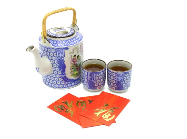 Chinese prosperity tea set and red packets — Stock Photo, Image