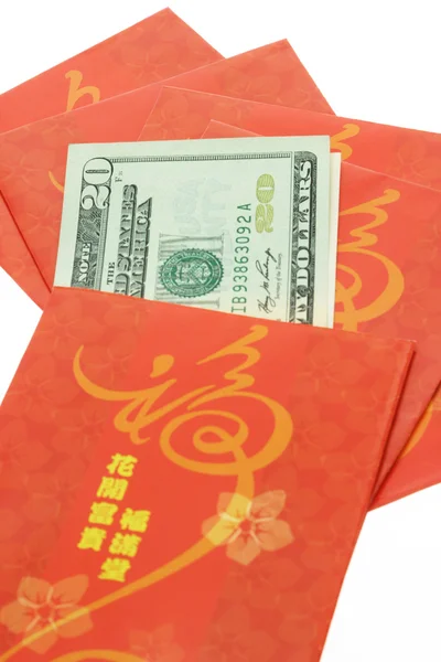 Ano Novo chinês pacotes vermelhos e dólares dos EUA — Fotografia de Stock