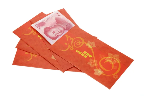Κινέζικη Πρωτοχρονιά κόκκινο πακέτα και ρενμίνμπι νόμισμα — Φωτογραφία Αρχείου
