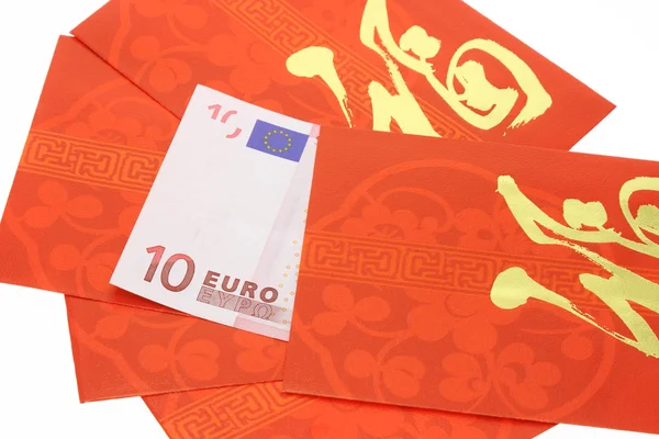 Κινέζικη Πρωτοχρονιά κόκκινο πακέτα και σημείωση νόμισμα ευρώ — Φωτογραφία Αρχείου