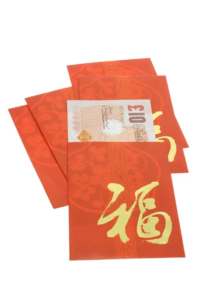 Čínský Nový rok červená pakety a britské bankovky — Stock fotografie
