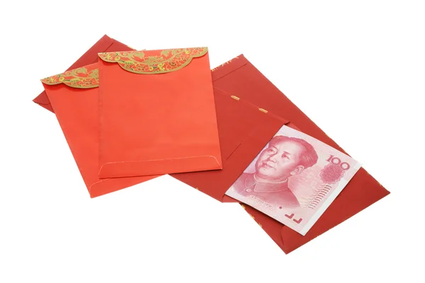 Čínský Nový rok červená pakety a jüanu poznámky — Stock fotografie