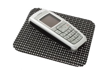 Mobile phone on non slip mat clipart
