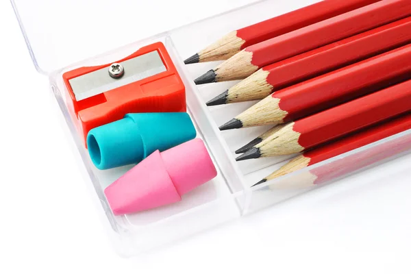 Pencils, sharpener and erasers in plastic box — Stock Photo, Image