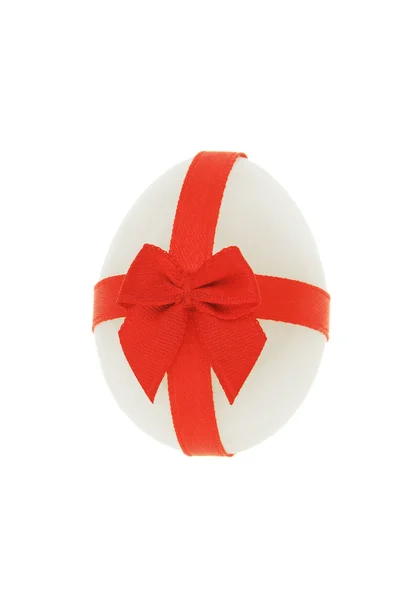 Easter egg decorated with red bow ribbon — Stock Photo, Image