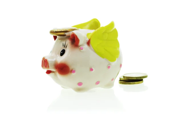 Flying piggy bank and coins — Stock Photo, Image