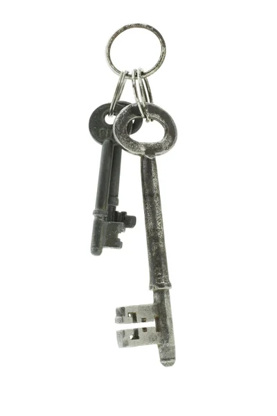 Старые ключи, подвешенные в воздухе — стоковое фото