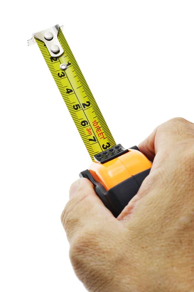 Mão segurando fita métrica — Fotografia de Stock