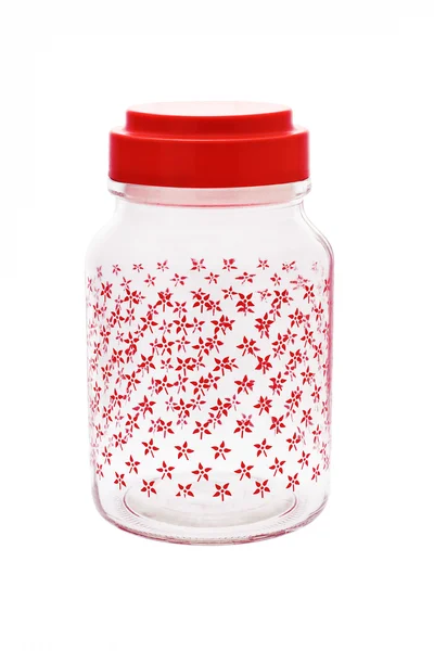 Glass jar with red floral design — Stock Photo, Image