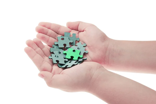 Hands holding pieces of jigsaw puzzle — Stock Photo, Image