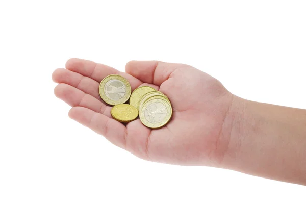 Монеты в руке ребенка — стоковое фото