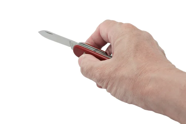Ruka držící červená kapesní nůž — Stock fotografie