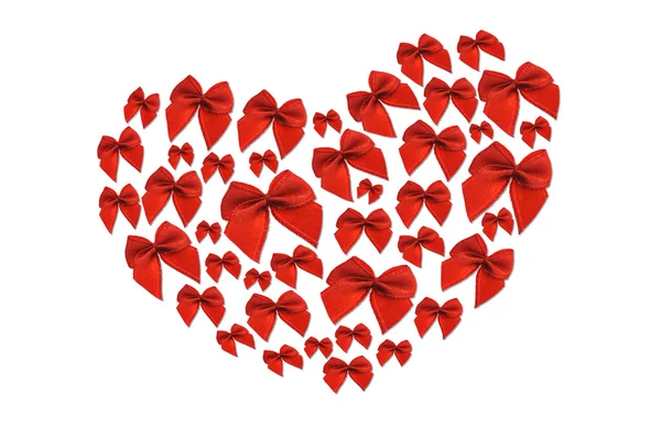 Červené ozdobné mašle ve tvaru srdce — Stock fotografie