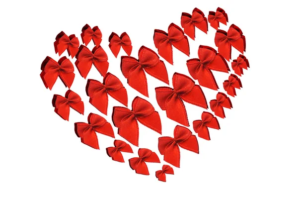 Czerwone łuki dekoracyjne w symbol kształt serca — Zdjęcie stockowe