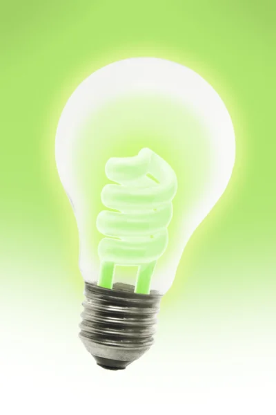 Glowing energy saving electric light bulb — Stock Photo, Image