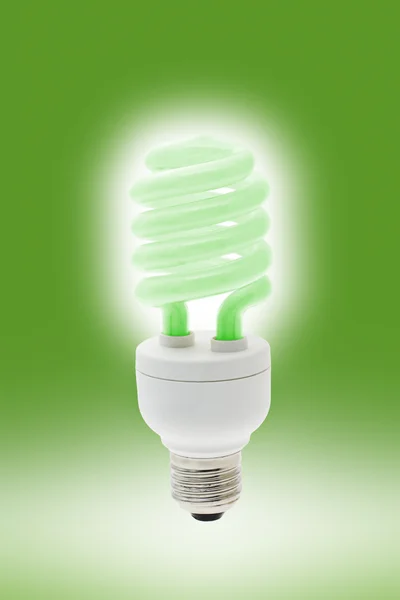 Glowing energy saving light bulb — Stock Photo, Image