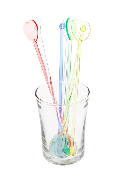 Kleurrijke kunststof swizzle sticks in glas — Stockfoto