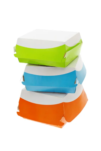 Три разноцветных бумажных коробки — стоковое фото