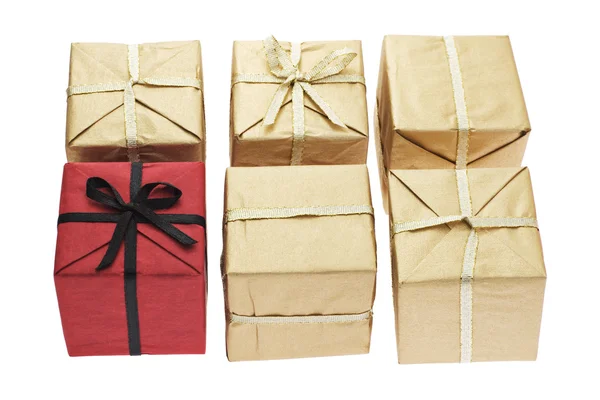 Red color gift box alone among brown boxes — Stock Photo, Image