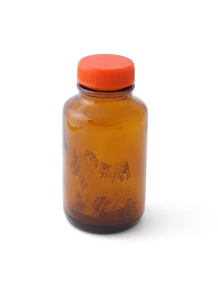 Boş cam şişe ve silika jel içine — Stok fotoğraf