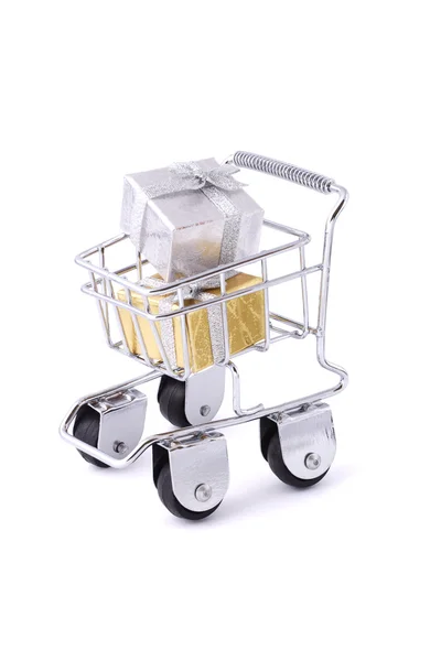 Gift boxes in a mini shopping cart — Stock Photo, Image