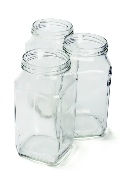 Три пустых стеклянных контейнера — стоковое фото