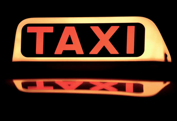 stock image Taxi sign on the roof.