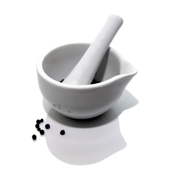 stock image White mortar and pestle with black pepper on white background