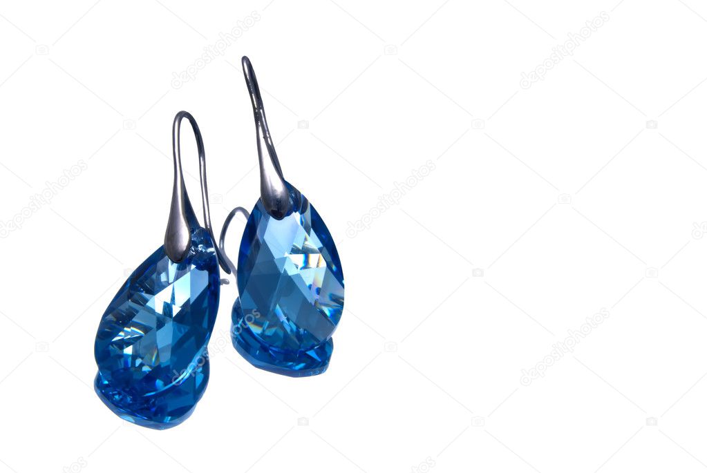 Handmade silver earrings with blue gemstones, isolated