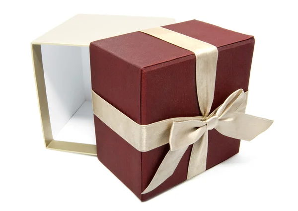 Empty opened gift box with a gold color ribbon — Stock Photo, Image