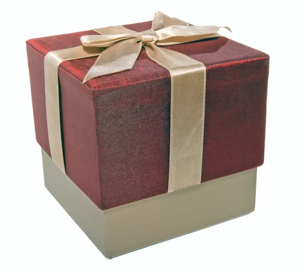Closed gift box with a gold ribbon Stock Image