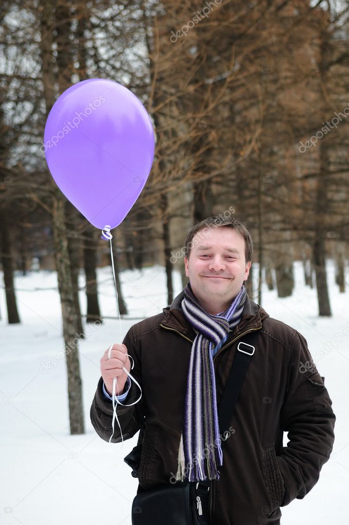 A man holding balloon
