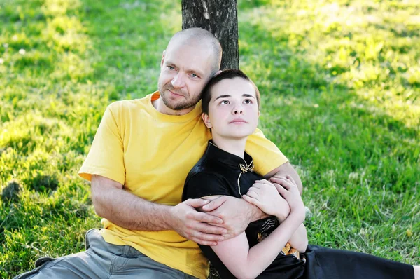 Bald-headed man embraced a girl — Stock Photo, Image
