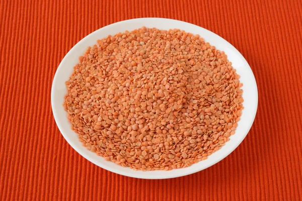 Dry lentil on a plate — Stock Photo, Image