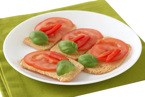 Toasts with tomato and basil — Stock Photo, Image