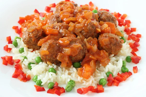 stock image Meatballs with rice with peas