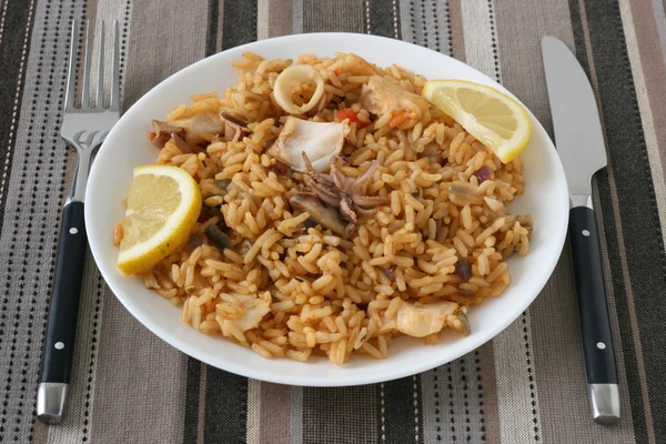 Rice with squid and fish — Stock Photo, Image