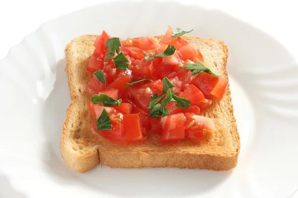 Toast with cut tomato — Stock Photo, Image