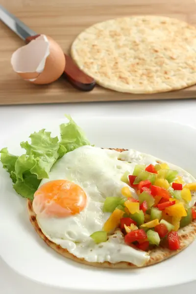 stock image Fried egg with pepper