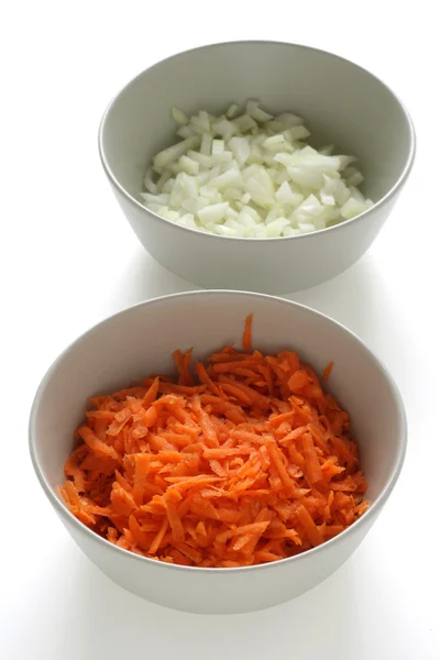 stock image Cut carrot and onion